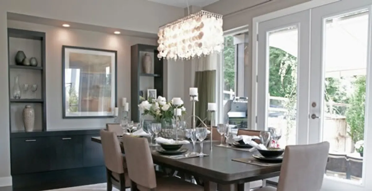 Elegant dining room chandelier installation above table in Littleton, CO