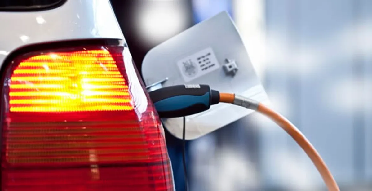 Electric car plugged into EV charger after professional installation in Littleton, CO