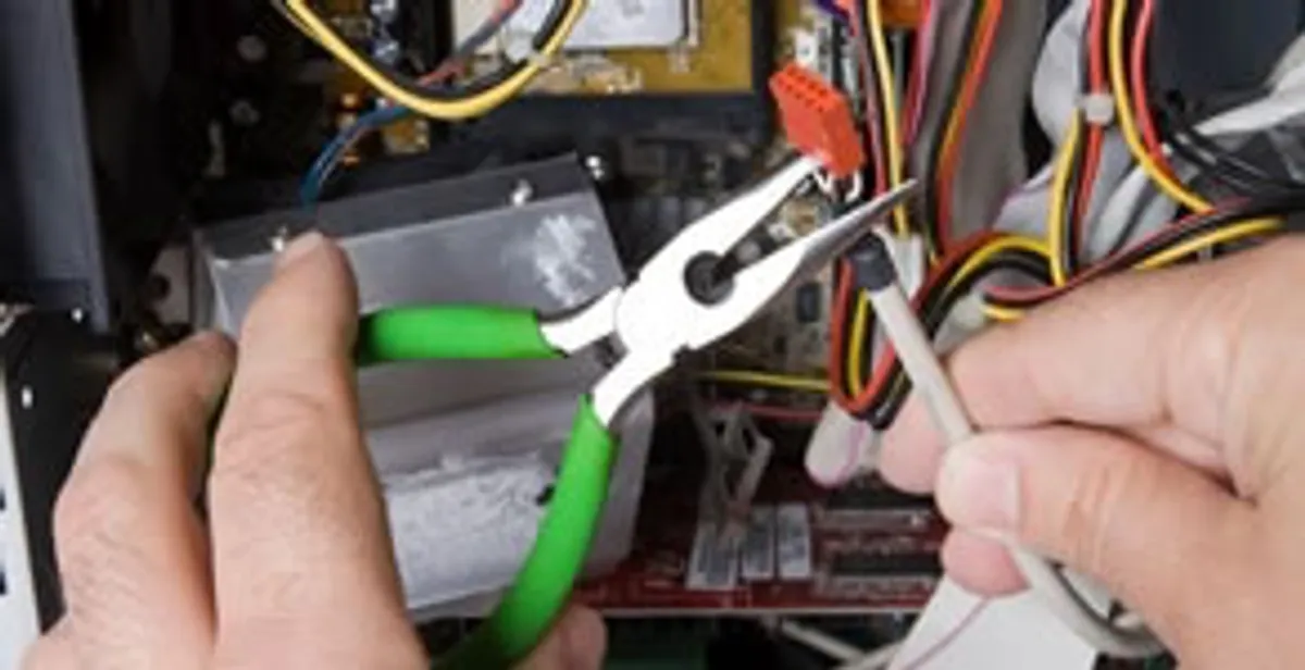 Licensed electrical contractor performing electrical repair with tools in Sedalia, CO