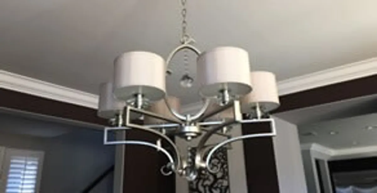 Modern chandelier installation with multiple light fixtures in Littleton, CO