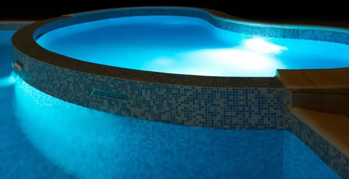 pool light installation and repair services highlighting illuminated pool interior lighting in Littleton, CO