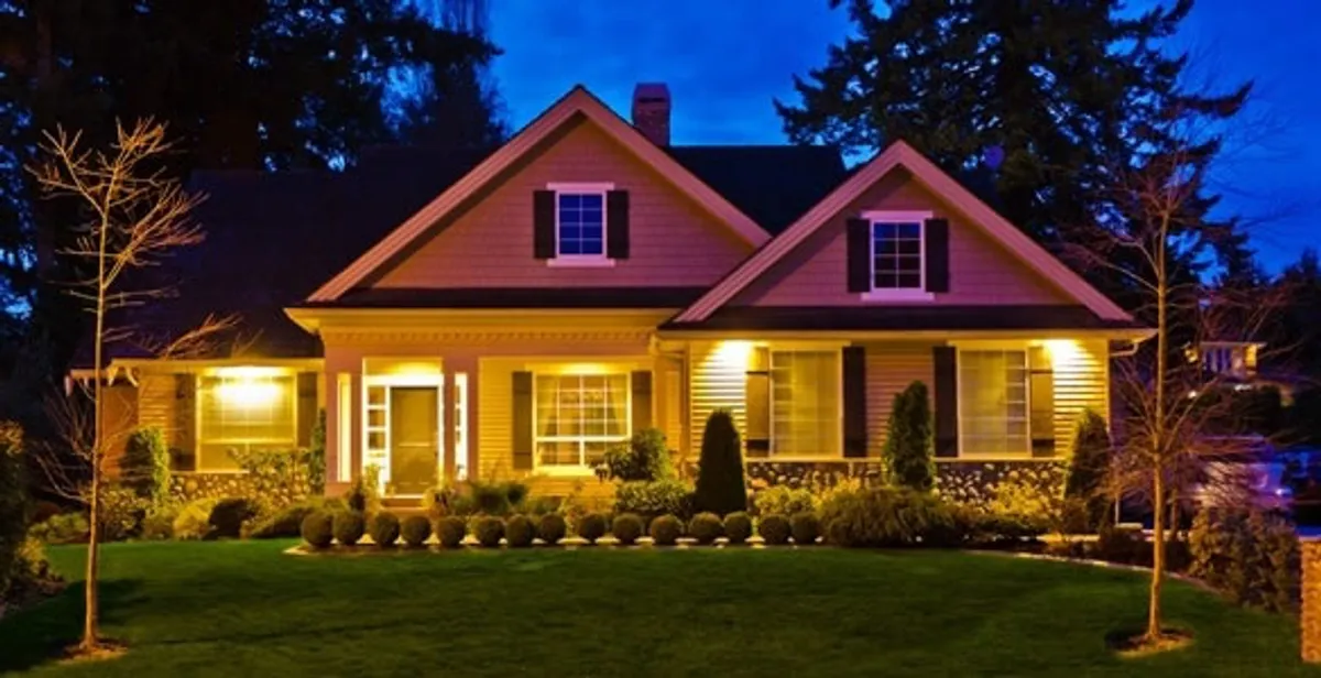 security light installation services illuminating a residential exterior at night in Littleton, CO