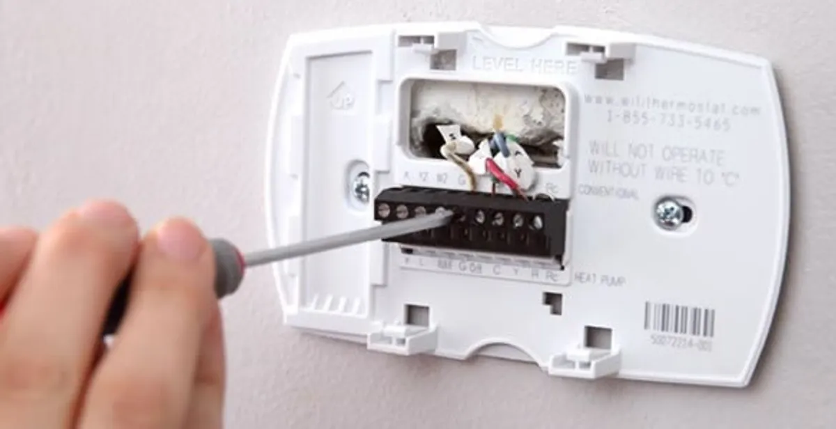 Thermostat installation service with proper wiring and secure wall mounting in Littleton, CO